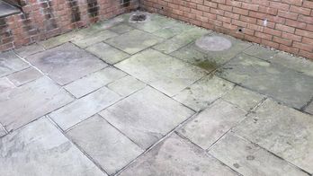 A patio that need cleaning