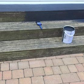 Decking steps being painted by our team